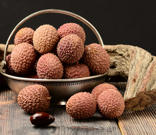 bunch of lychees fruit in basket