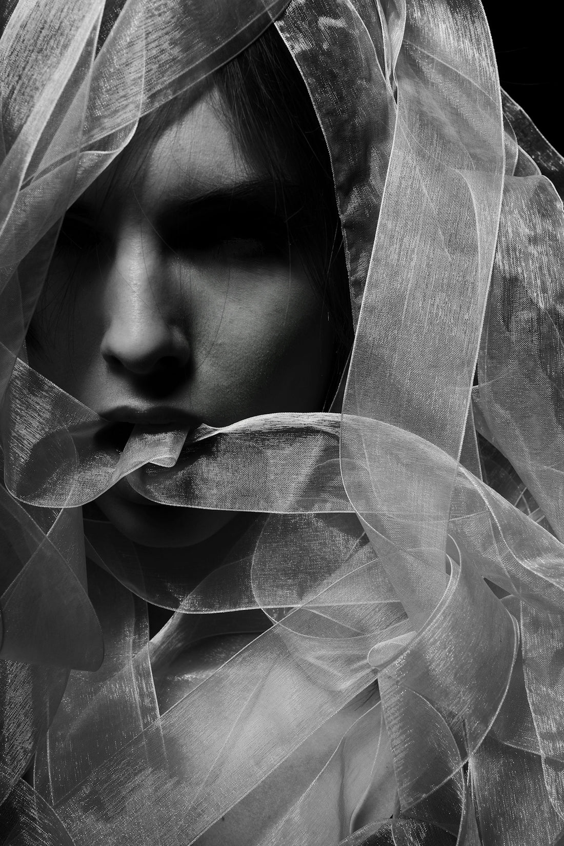 woman in white veil in grayscale
