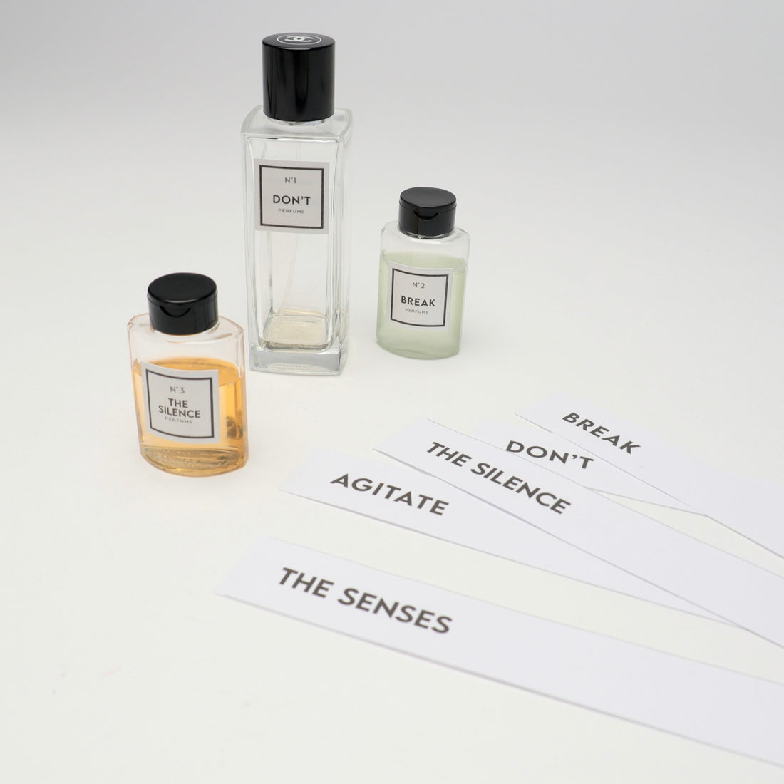 a couple of bottles of perfume sitting on top of a table